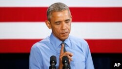 FILE - President Barack Obama speaking about the Flint, Michigan, water crisis, Jan. 20, 2016, at the United Auto Workers-General Motors Center for Human Resources in Detroit. 