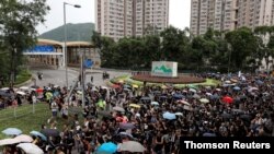 Anti-extradition bill protesters march at Tseung Kwan O residential district in Hong Kong, Aug. 4, 2019. 