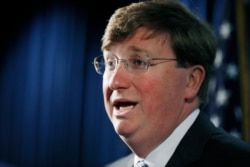 Republican Gov. Tate Reeves addresses reporters during a news conference, March 4, 2020, in Jackson, Miss.