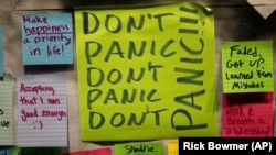 This November 14, 2019, photo shows notes attached to the Resilience Project board on the campus of Utah Valley University in Orem, Utah. The purpose of the project is to let students know that it is OK to struggle.