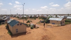 FILE - A man walks along a path in the Hamdallaye refugee camp amid the COVID-19 pandemic in Niger, July 29, 2020. (UNHCR/Selim Meddeb/Handout via Reuters)