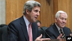 Senate Foreign Relations Committee Chairman Senator Kerry, left, with committee's ranking Republican, Senator Lugar, Washington, Feb. 2011.