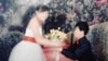 A wedding photo of Ly thi Minh, then 14 years old, and Pay Long Phe, the Chinese man who bought her from human traffickers. 