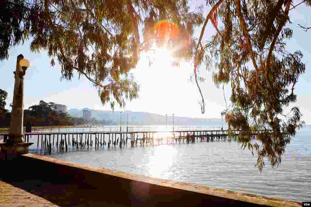 The sun sets over a pier and the waterfront quay in the Black Sea port of Sukhumi, a landscape that prompted early 20th century painters and vacationers to call Abkhazia &lsquo;the Russian Riviera.&rsquo; (V. Undritz/VOA)