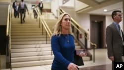 FILE - Congresswoman Marjorie Taylor Greene and fellow Republicans arrive for a meeting at the Capitol in Washington, May 13, 2021. 