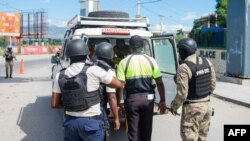 Police officers patrol near the Toussaint Louverture International Airport in Port-au-Prince, Haiti, on Nov. 12, 2024.