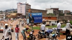 Many of the 2.4 million who live in the capital of Cameroon has to search for water every day. This photograph was taken in Yaounde during the 2011 Senate elections. Paul Biya, 82, has been president for 32 years. 