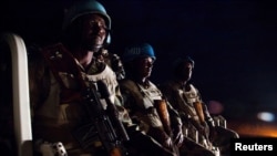 FILE - UNAMID peacekeepers from Ethiopia prepare to go on a night patrol on a pick-up vehicle, in Gereida (South Darfur).