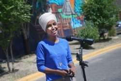 FILE - Democrat Rep. Ilhan Omar addresses the media in Minneapolis, Minnesota, Aug. 11, 2020.