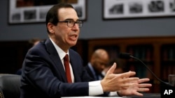 FILE - Treasury Secretary Steven Mnuchin testifies before a House Appropriations subcommittee, April 9, 2019, on Capitol Hill in Washington.