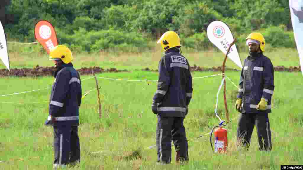 Firefighters stand guard as 105 tons of elephant ivory and more than 1 ton of rhino horn were burned, at Nairobi National Park, Kenya, April 30, 2016.