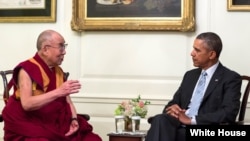 President Barack Obama meets with the Dalai Lama in the Map Room of the White House, Feb. 21, 2014. (Official White House Photo by Pete Souza) 