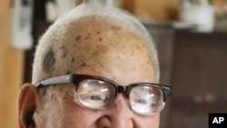 Jirouemon Kimura, of Japan, smiles on his 114th birthday in April 2011. A new study finds happy people tend to live longer.