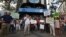 Demonstrators hold signs as they protest against what they say is abuse of the system by banks and the failure of the government to stop them, in front of the headquarters of Spain's center-right People's Party [Partido Popular] in Madrid, July 8, 2012.