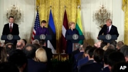 President Donald Trump speaks during a news conference with, from left, Latvian President Raimonds Vejonis, Estonian President Kersti Kaljulaid, and Lithuanian President Dalia Grybauskaite in the East Room of the White House, April 3, 2018, in Washington.