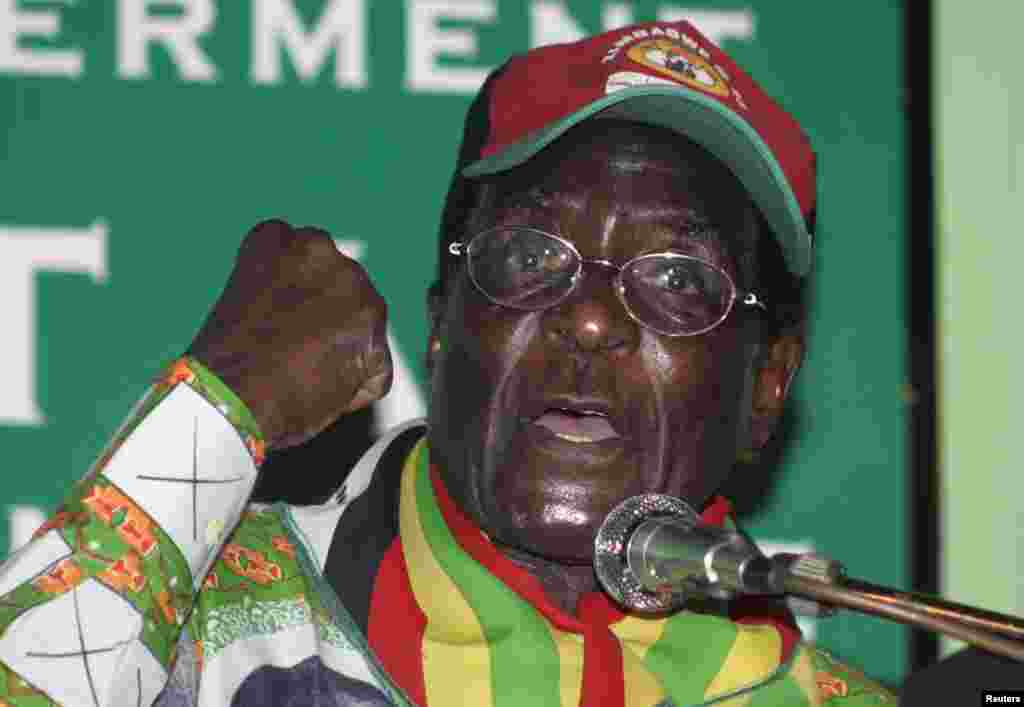 Zimbabwe's President Robert Mugabe gestures as he speaks to party supporters at the launch of his Presidential run-off campaign in the capital Harare May 25, 2008.