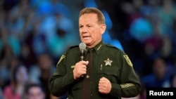 FILE - Broward County Sheriff Scott Israel speaks before the start of a CNN town hall meeting in Sunrise, Florida, Feb. 21, 2018. 