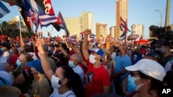 People attend a cultural-political event on the seaside Malecon Avenue with thousands of people in a show of support for the Cuban revolution six days after the uprising of anti-government protesters across the island, in Havana, July 17, 2021.