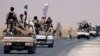 Syrian Democratic Forces (SDF) fighters head to Raqqa, Syria, June 6, 2017. 