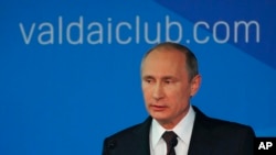 Russian President Vladimir Putin speaks to political experts at a meeting of the Valdai International Discussion Club in Sochi, Russia, Oct. 24, 2014.