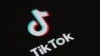 (FILES) This illustration picture taken on May 27, 2020 in Paris shows the logo of the social network application Tik Tok on the screen of a phone.