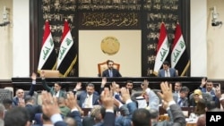 ইরাকি সংসদে ভোট দেয়ার দৃশ্য। ফাইল ফটোঃ ১১ জুন, ২০২৩। 