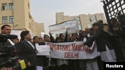 A woman shouts during a vigil in Abuja calling for the release of Nigerian schoolgirls abducted in the remote village of Chibok.