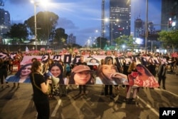 Relatives and supporters of Israelis abducted on October 7 by Hamas militants hold placards and portraits of hostages during a demonstration calling for their release in Tel Aviv on May 22, 2024.