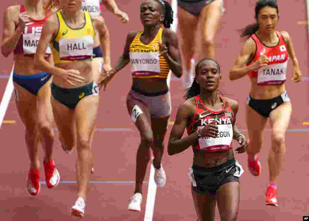 Faith Kipyegon, of Kenya races to win a women's 1,500-meter heat at the 2020 Summer Olympics, Monday, Aug. 2, 2021, in Tokyo, Japan. (AP Photo/Charlie Riedel)