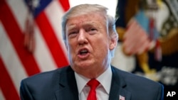 FILE - In this Feb. 1, 2019, photo, President Donald Trump speaks in the Cabinet Room of the White House in Washington. 