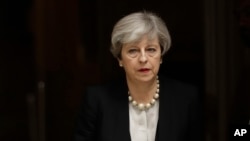 British Prime Minister Theresa May departs 10 Downing Street, London, to go to Manchester, May 23, 2017. The day after an apparent suicide bomber attacked an Ariana Grande concert as it ended Monday night, killing over a dozen of people among a panicked c