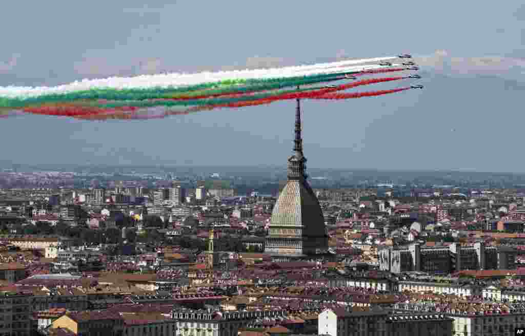 The Frecce Tricolori (Tricolor Arrows) aerobatic squad of the Italian Air Force flies over Turin, northern Italy, as part of the celebrations for the 74th anniversary of the Italian Republic born on June 2, 1946.