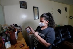 FILE - Roxanne Schaefer is pictured in her apartment in West Warwick, R.I., July 27, 2021. Schaefer, months behind on rent, was bracing for the end of a federal residential eviction moratorium at midnight Saturday.