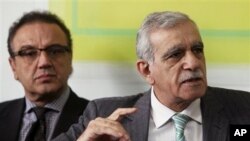 Pro-Kurdish Peace and Democracy Party lawmakers Ahmet Turk, right, and Sirri Sakik at news conference, Ankara, Turkey, Jan. 13, 2012.