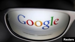 FILE - A Google search page is reflected in sunglasses in this photo illustration taken in Brussels.