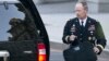 National Security Agency Director General Keith Alexander leaves the White House in Washington, Oct. 2, 2013.