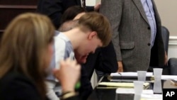 FILE - Joseph Roof, grandfather of Dylan Roof, walks past his grandson to address the court as Dylann Roof appears in the Charleston County Court Monday April 10, 2017 to enter his guilty plea on murder charges in Charleston, S.C. 