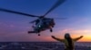 In this undated photo from the Australian Defense Force, a helicopter prepares to take off from the deck of HMAS Hobart off northern Australia. Three new top-secret data centers announced on July 4, 2024, would provide the military with “state-of-the-art collaborative space."