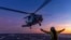 In this undated photo from the Australian Defense Force, a helicopter prepares to take off from the deck of HMAS Hobart off northern Australia. Three new top-secret data centers announced on July 4, 2024, would provide the military with “state-of-the-art collaborative space."
