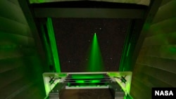 NASA’s Lunar Lasercom Optical Communications Telescope Laboratory (OCTL) Terminal, sending a laser beam to the moon.