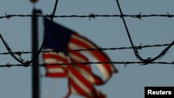 FILE PHOTO: Migrants are transferred to a plane to be expelled from U.S., in El Paso