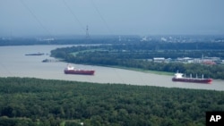 Mississippi river traffic moves in the aftermath of Hurricane Ida, Aug. 30, 2021, near Lafitte, La. 