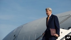 FILE - U.S. Secretary of State John Kerry gets off his plane upon his arrival at Rome's Ciampino airport, Feb. 1, 2016. 