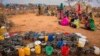 People wait for food and water in the Warder district in the Somali region of Ethiopia, Jan. 28, 2017. Ethiopia is struggling to counter a new drought in its east that authorities say has left 5.6 million people in need.