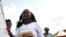 A supporter of Ivorian President Alassane Ouattara dances as she holds a banner reading in French "Peace and reconciliation" during a meeting on April 22, 2012 in Guiglo. 