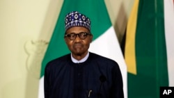 Nigerian President Muhammadu Buhari attends a press briefing after meeting with South African President Cyril Ramaphosa in Pretoria, South Africa Thursday, Oct. 3, 2019.