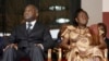 FILE - Laurent Gbagbo and his wife Simone Ehivet Gbagbo attend a memorial ceremony at Felix Houphouet Boigny stadium in Abidjan.