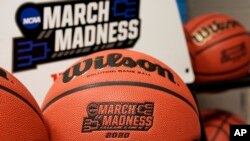 Official March Madness 2020 tournament basketballs are seen in a store room at the CHI Health Center Arena, in Omaha, Nebraska, March 16, 2020.