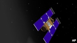 Artist rendering of Stardust-NExT spacecraft nearing comet Tempel 1, 21 Jan 2011