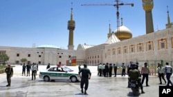 Police officers patrol the scene, around the shrine of late Iranian revolutionary founder Ayatollah Khomeini, after an attack by several perpetrators in Tehran, Iran, June 7, 2017.